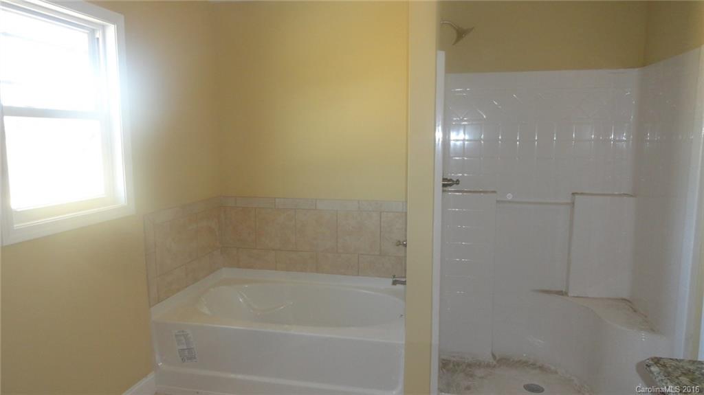 4759 Kemp Dellinger Road, Unit 1 Maiden, NC 28650 - Photo 22 of 24 a bathroom with a bathtub