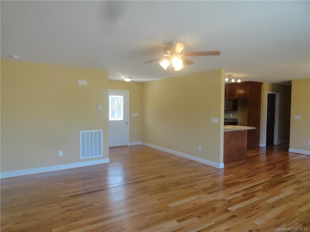 4759 Kemp Dellinger Road, Unit 1 Maiden, NC 28650 - Photo 5 of 24 an empty room with wooden floor and windows
