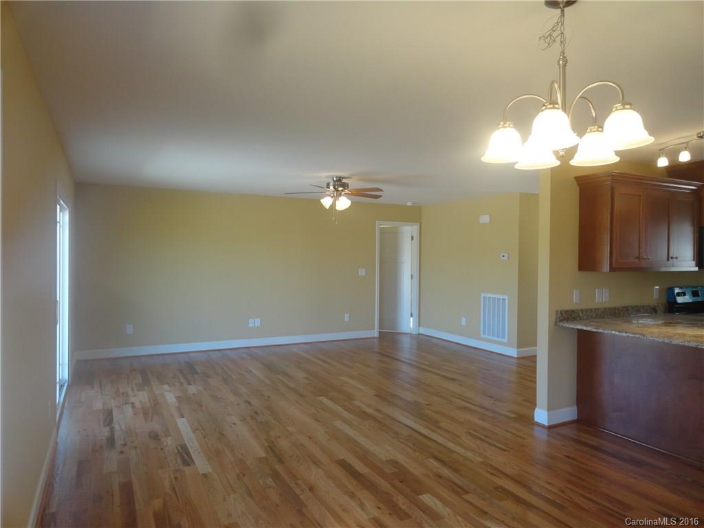 4759 Kemp Dellinger Road, Unit 1 Maiden, NC 28650 - Photo 7 of 24 a view of a kitchen with a dishwasher cabinets and wooden floor