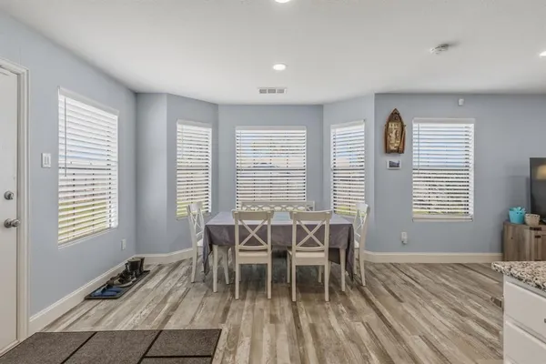 a view of a dining room with furniture and window