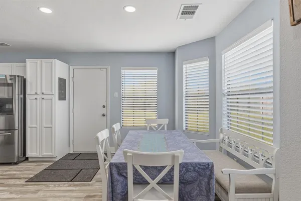 a kitchen with a refrigerator stove and sink