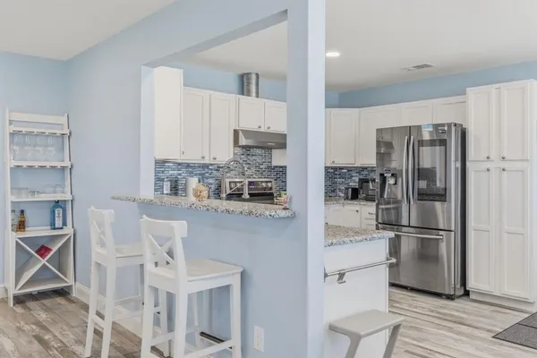 a kitchen with a sink cabinets and window