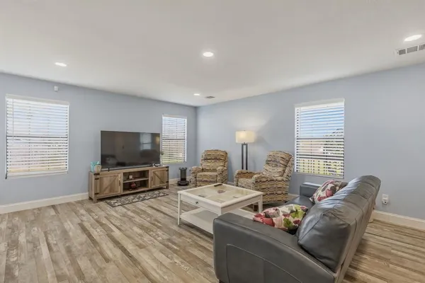 a living room with furniture and a table