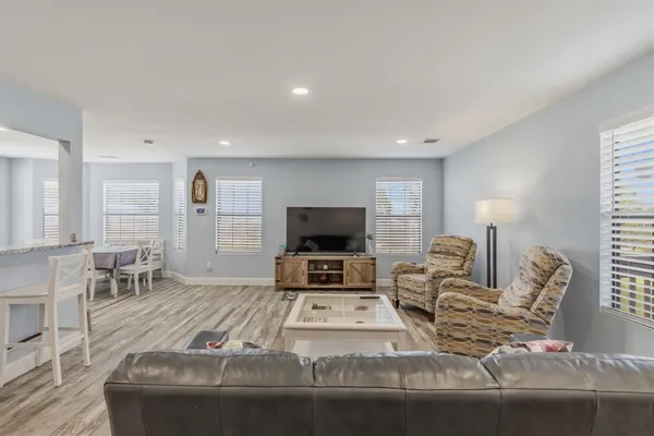 a dining room with furniture and windows