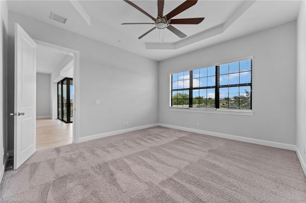 15244 Zeno Way, Unit 201 Naples, FL 34114 - Photo 27 of 50 a view of an empty room with a window