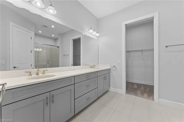 a bathroom with a double vanity sink mirror and double