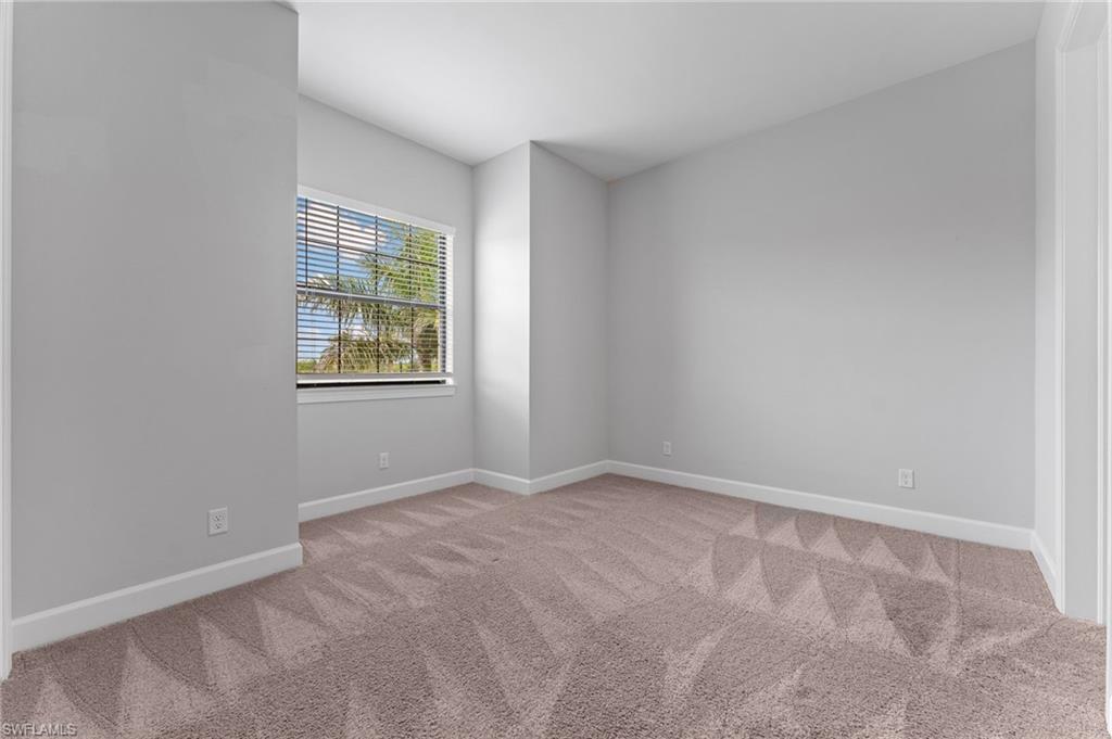 15244 Zeno Way, Unit 201 Naples, FL 34114 - Photo 33 of 50 an empty room with windows