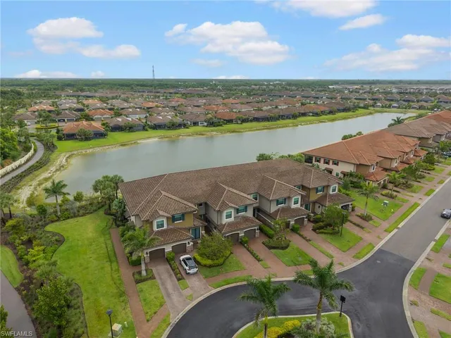 an aerial view of a house with a lake view