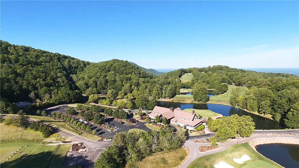 Lot 18 Raven Road Landrum, SC 29356 - Photo 6 of 7 Experience prime living with exclusive golf course access and tranquil lake views.