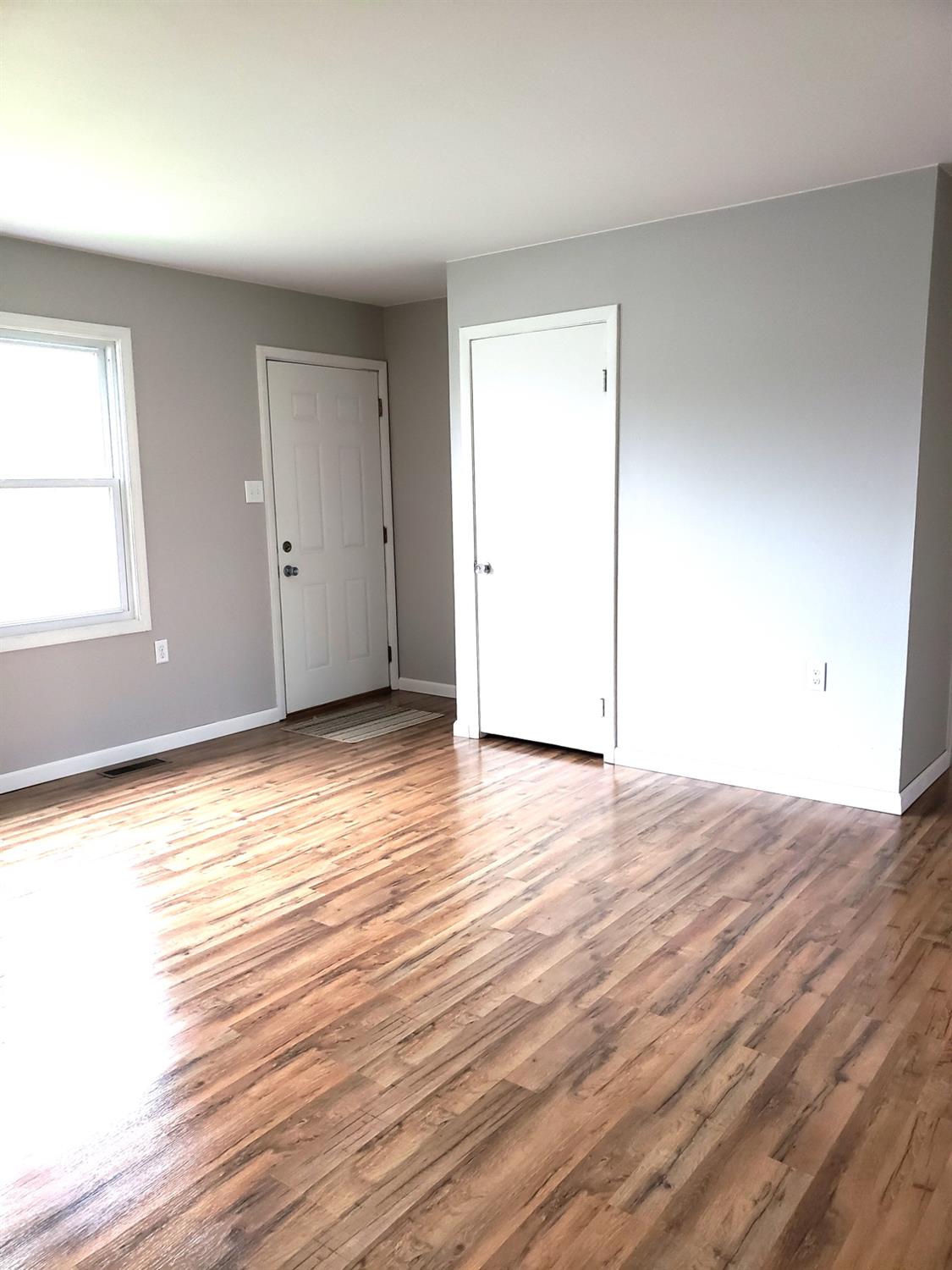 734 Governor Road Valparaiso, IN 46385 - Photo 4 of 15 an empty room with wooden floor and windows