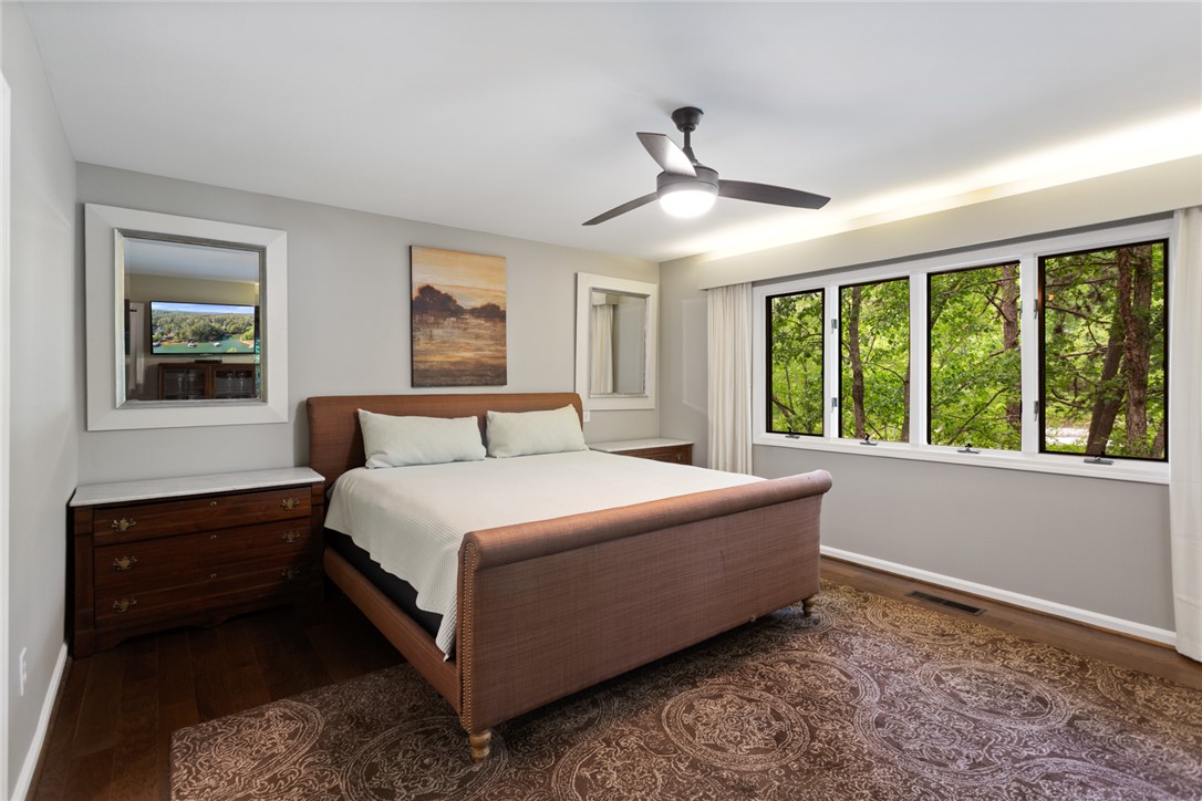 5 High Tide Court Salem, SC 29676 - Photo 12 of 40 This serene bedroom offers tranquil forest views and natural light, creating a peaceful retreat.
