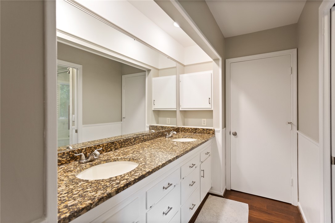 5 High Tide Court Salem, SC 29676 - Photo 16 of 40 This primary bathroom offers dual sinks with granite countertops and a clean, functional design.