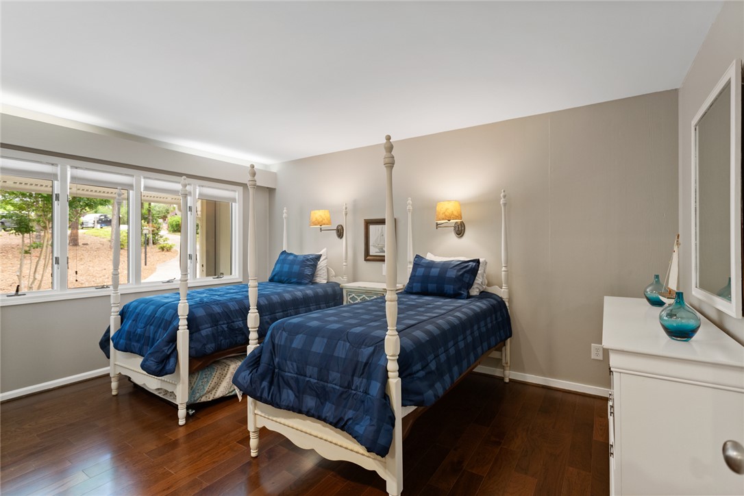 5 High Tide Court Salem, SC 29676 - Photo 19 of 40 This inviting bedroom features rich hardwood flooring and large windows, offering ample natural light.