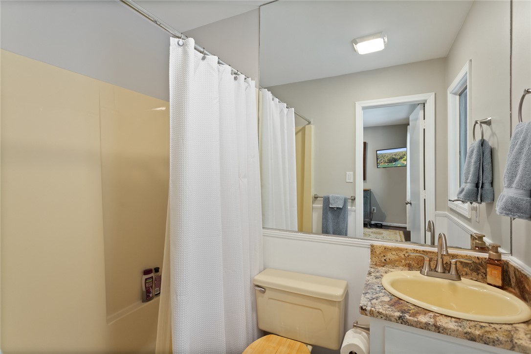 5 High Tide Court Salem, SC 29676 - Photo 22 of 40 This bathroom features a functional vanity with ample counter space and a classic shower-tub combination.