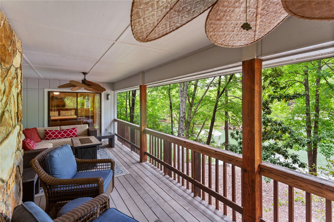5 High Tide Court Salem, SC 29676 - Photo 25 of 40 This inviting porch offers serene forest and water views, perfect for peaceful outdoor enjoyment.