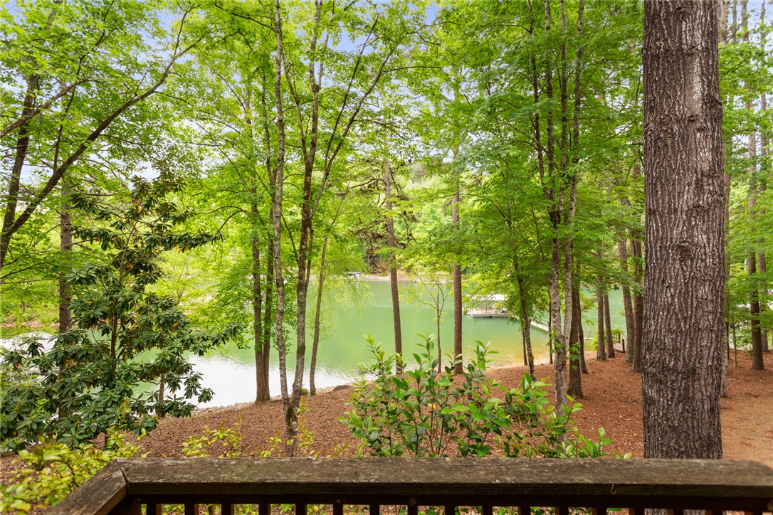 5 High Tide Court Salem, SC 29676 - Photo 27 of 40 This serene outdoor space offers captivating lake views amidst lush greenery.