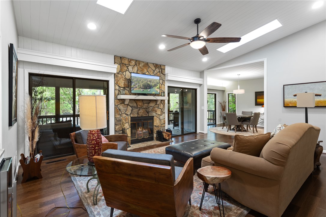 5 High Tide Court Salem, SC 29676 - Photo 5 of 40 This inviting living space features an impressive stone fireplace, rich hardwood flooring, and abundant natural light.