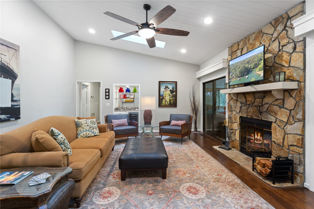 5 High Tide Court Salem, SC 29676 - Photo 6 of 40 This inviting living space features rich hardwood floors and a striking stone fireplace.