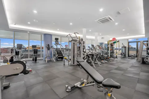 a swimming pool view with a outdoor seating space