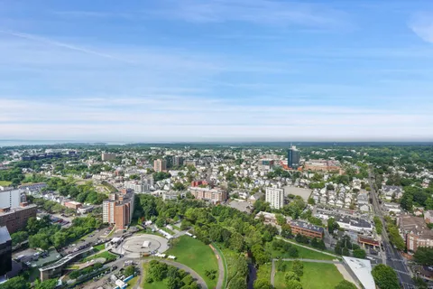 a living room with furniture and a floor to ceiling window