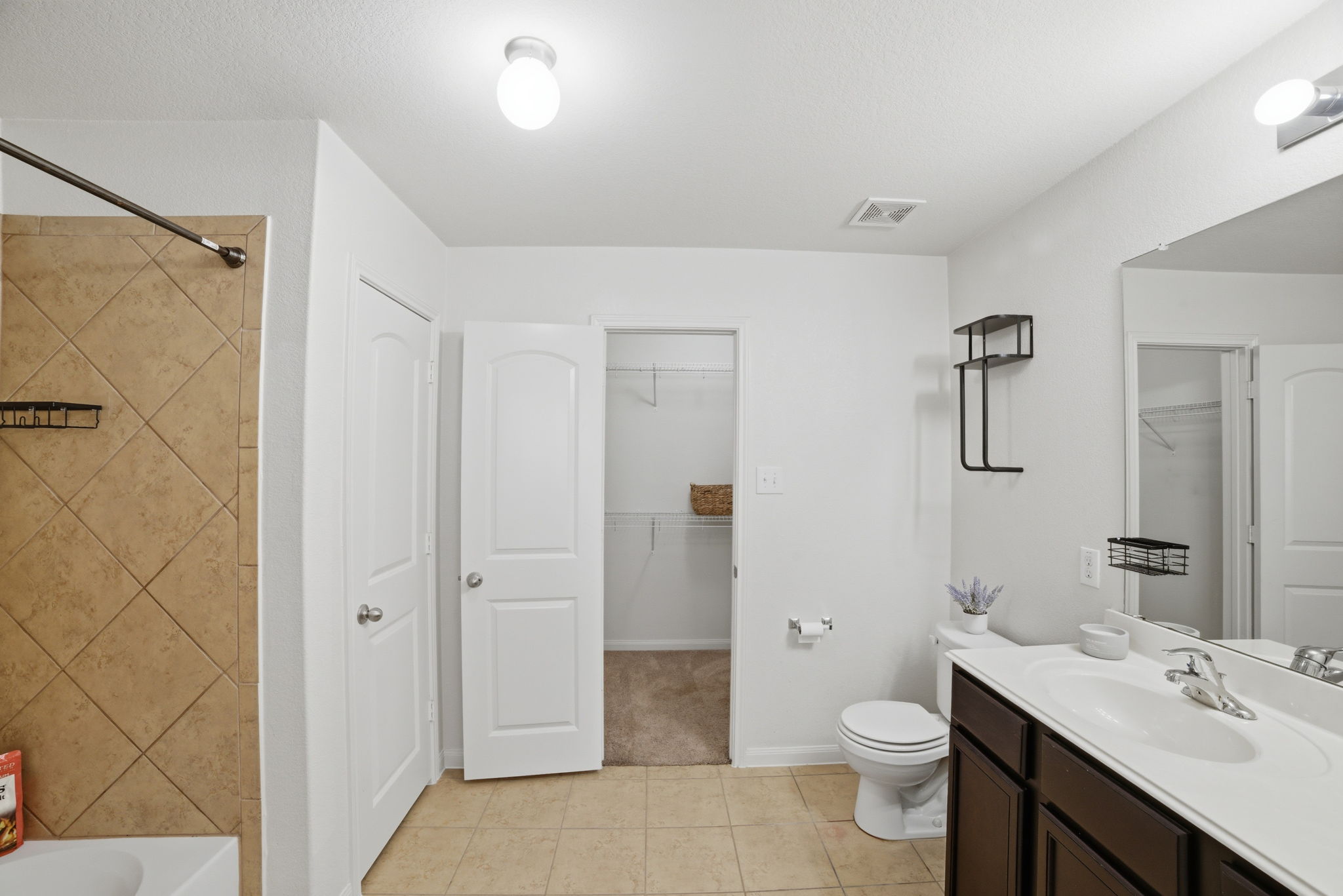 107 Millers Loop Jarrell, TX 76537 - Photo 19 of 31 a bathroom with a sink a toilet and shower