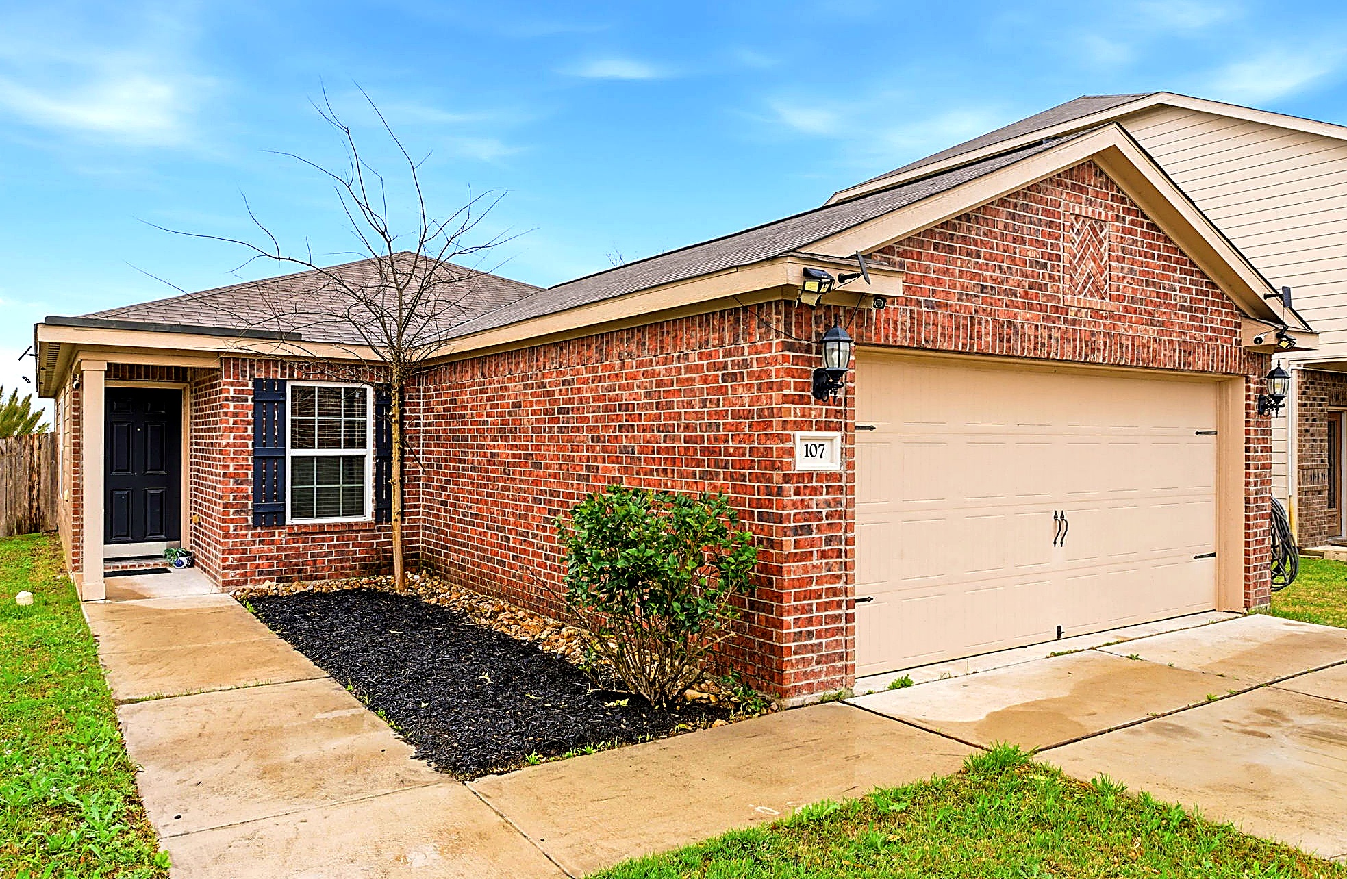 107 Millers Loop Jarrell, TX 76537 - Photo 2 of 31 a view of a house with a patio