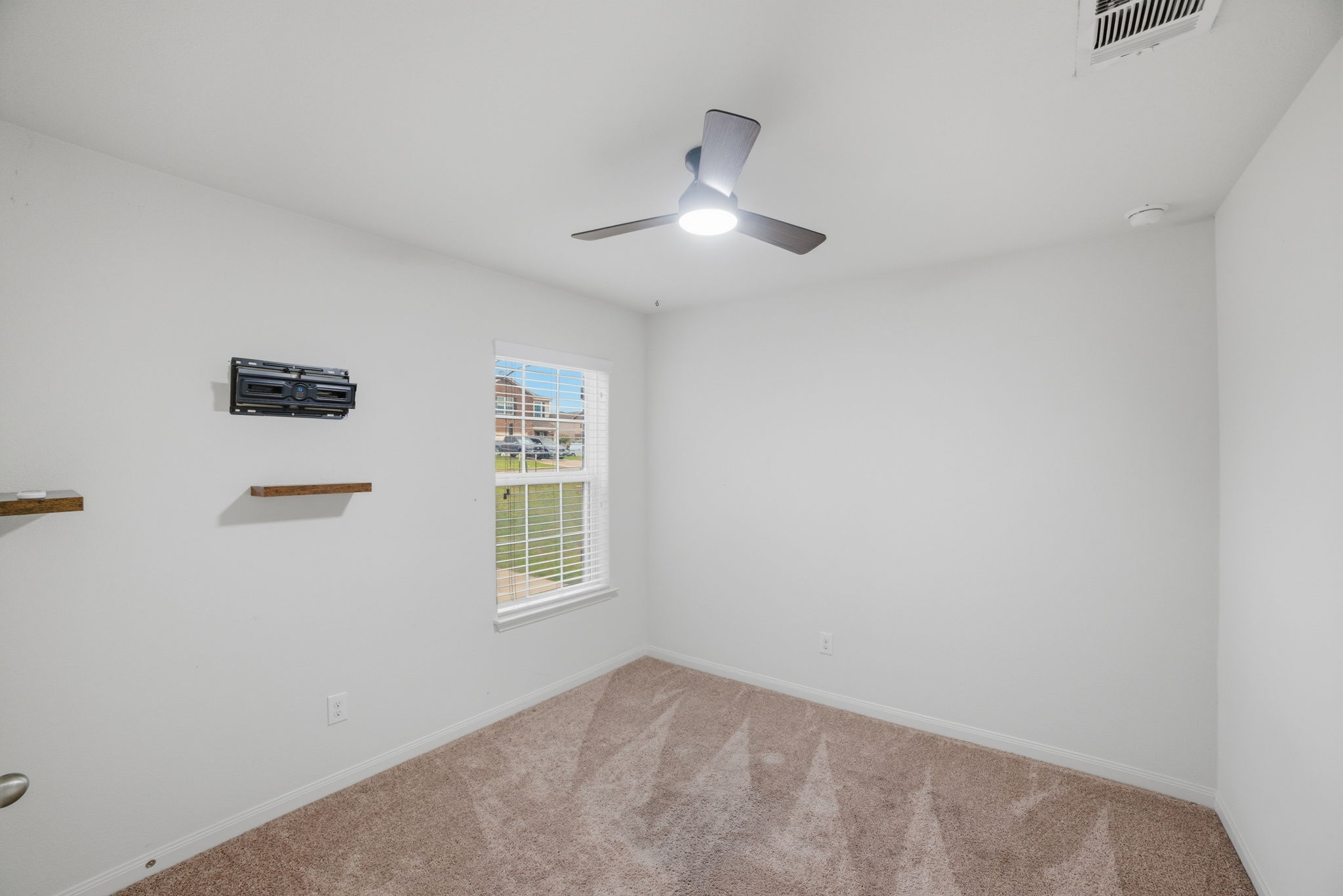 107 Millers Loop Jarrell, TX 76537 - Photo 24 of 31 a view of an empty room with a window