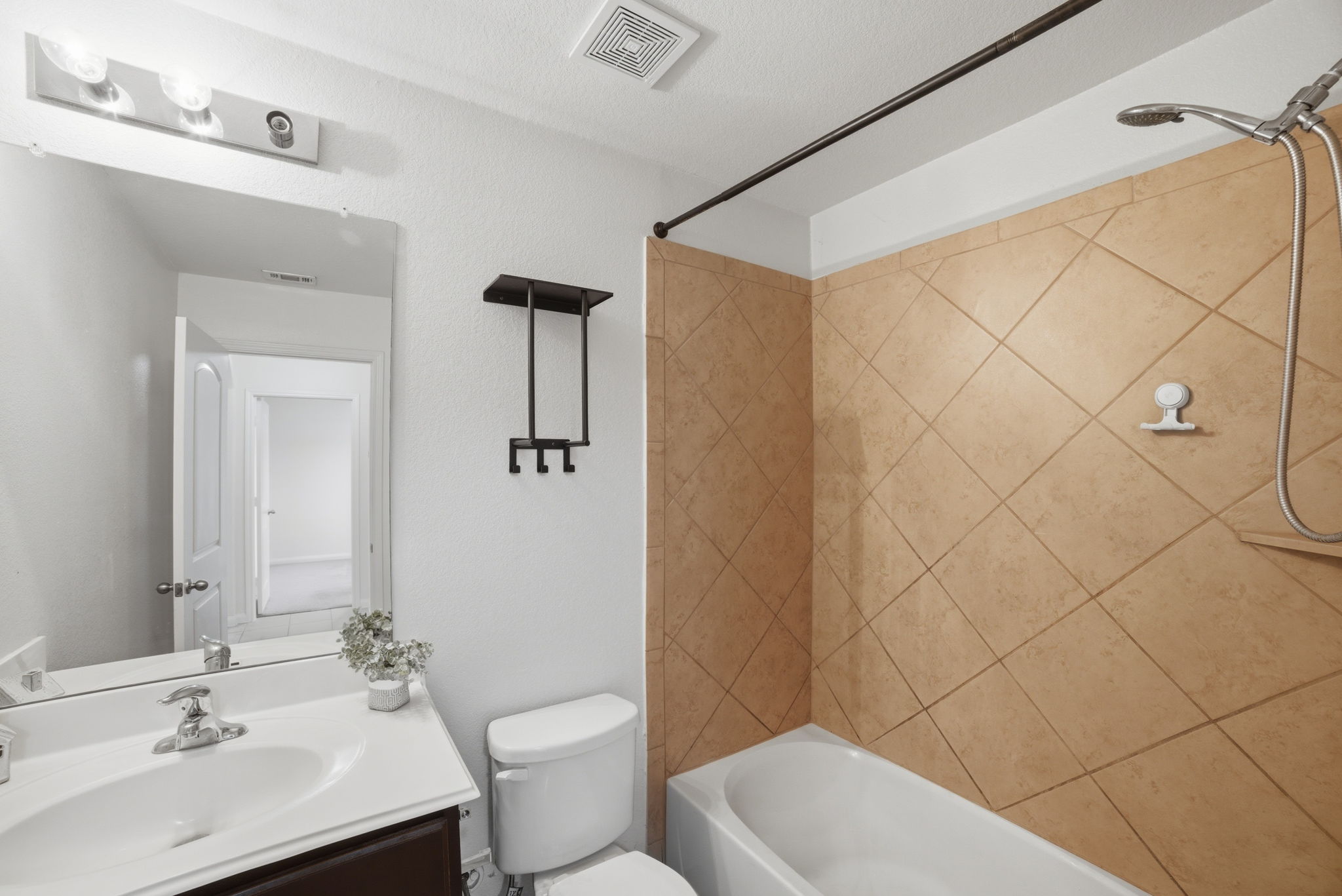 107 Millers Loop Jarrell, TX 76537 - Photo 27 of 31 a bathroom with a sink a toilet and shower