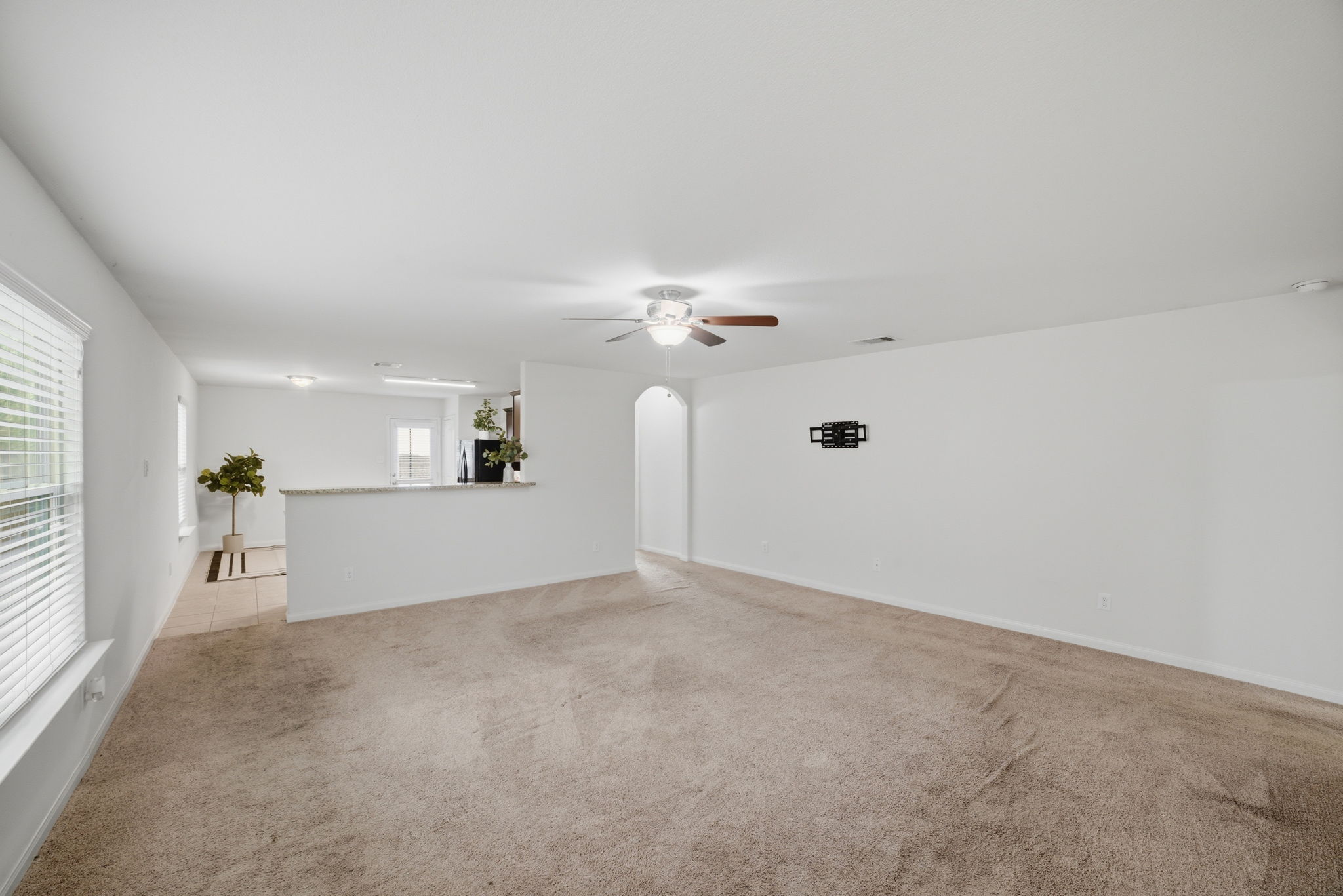 107 Millers Loop Jarrell, TX 76537 - Photo 9 of 31 a view of a kitchen with a sink and a chandelier fan