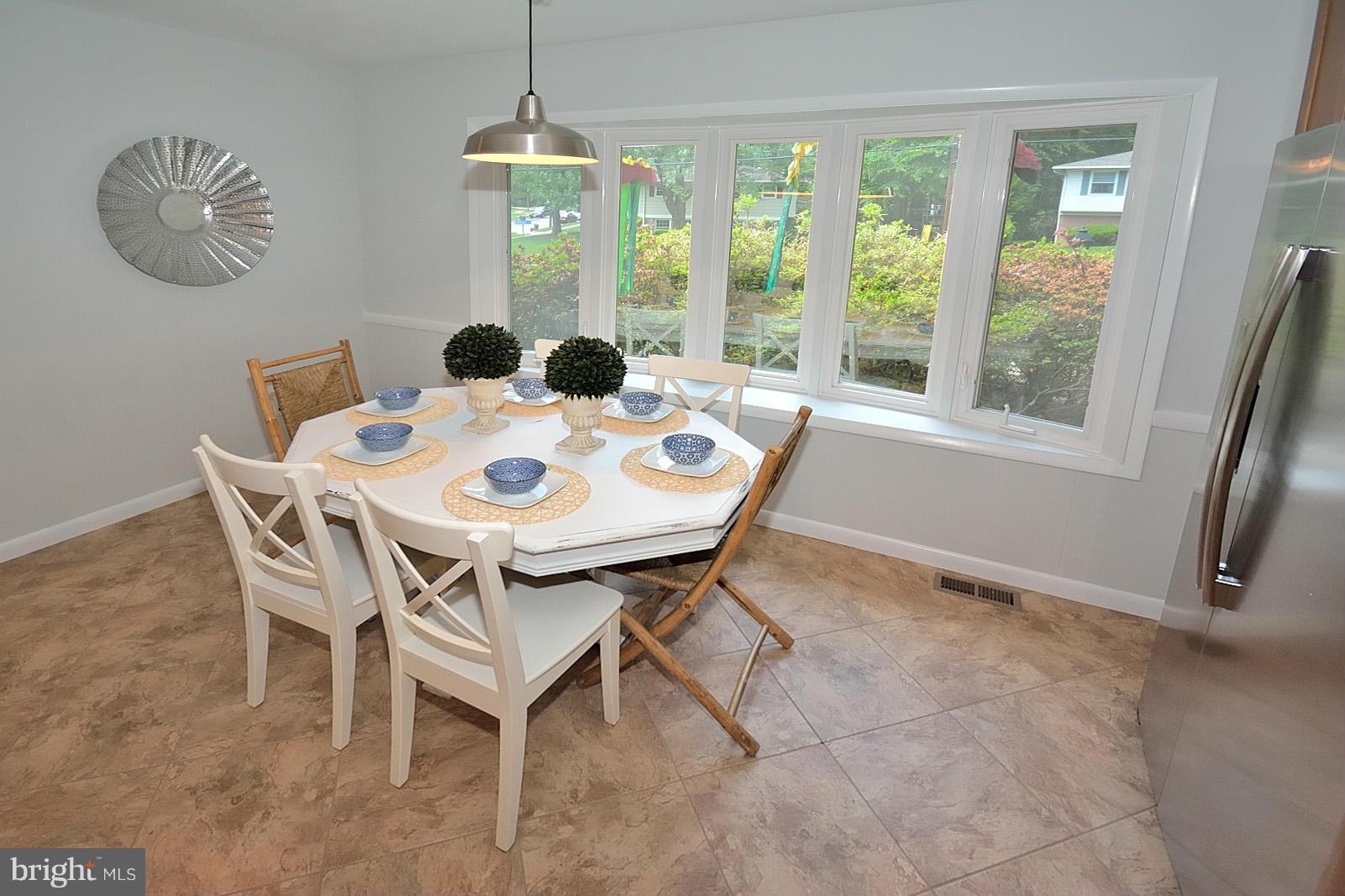 5613 Ravenel Lane Springfield, VA 22151 - Photo 12 of 30 a view of a dining room with furniture window and outside view