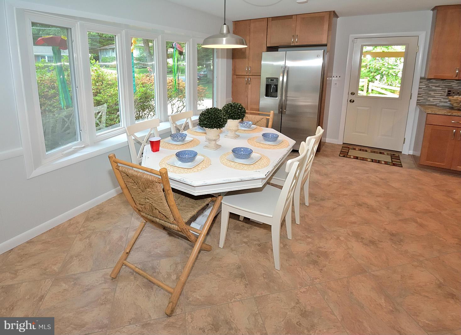 5613 Ravenel Lane Springfield, VA 22151 - Photo 13 of 30 a dining room with furniture and window
