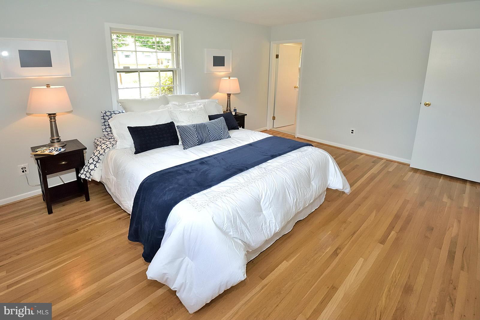 5613 Ravenel Lane Springfield, VA 22151 - Photo 15 of 30 a bedroom with bed and window