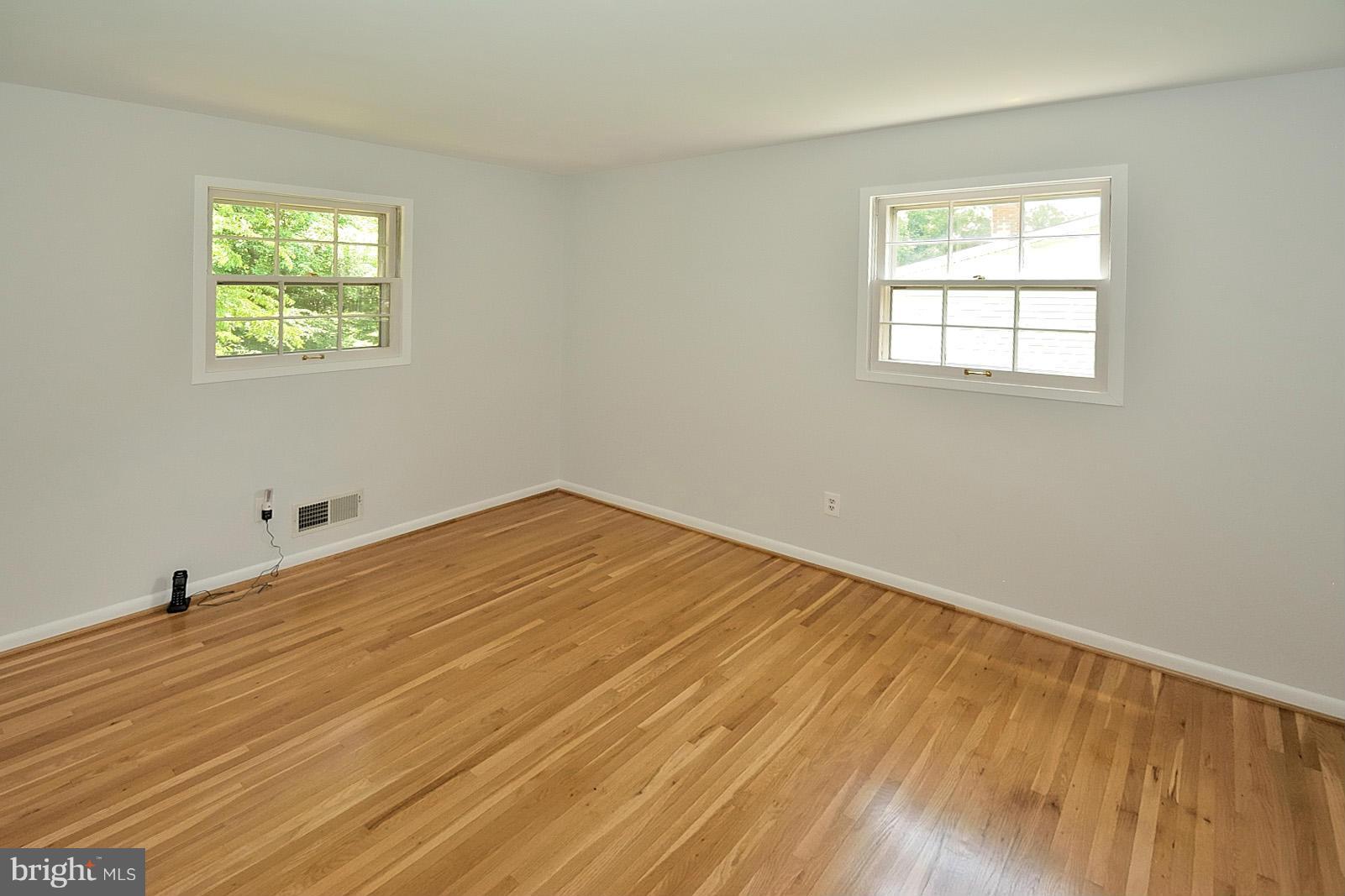 5613 Ravenel Lane Springfield, VA 22151 - Photo 17 of 30 a view of a room with wooden floor and windows