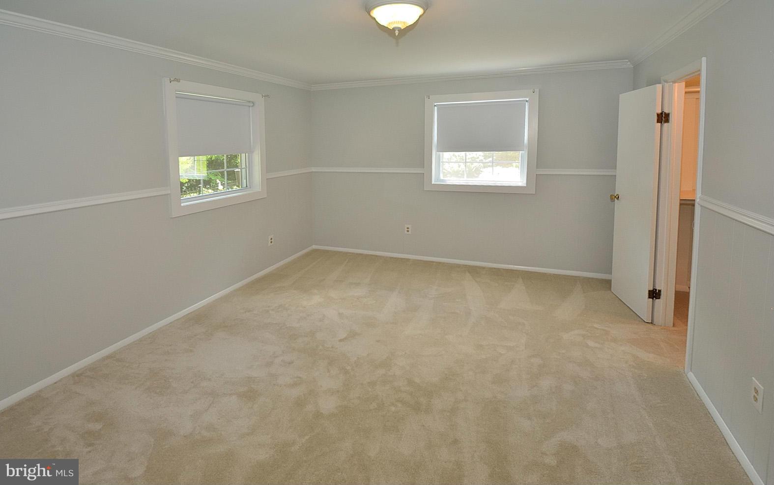 5613 Ravenel Lane Springfield, VA 22151 - Photo 20 of 30 an empty room with windows and closet