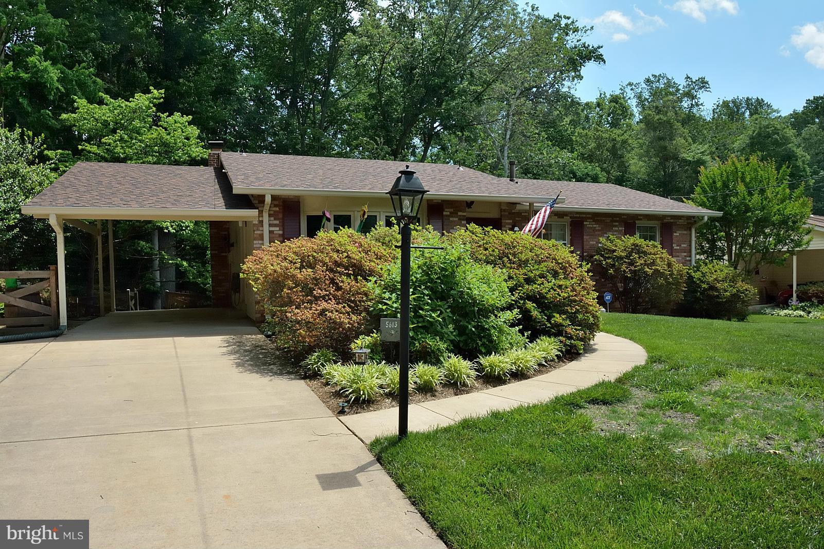 5613 Ravenel Lane Springfield, VA 22151 - Photo 2 of 30 a view of a house with a garden