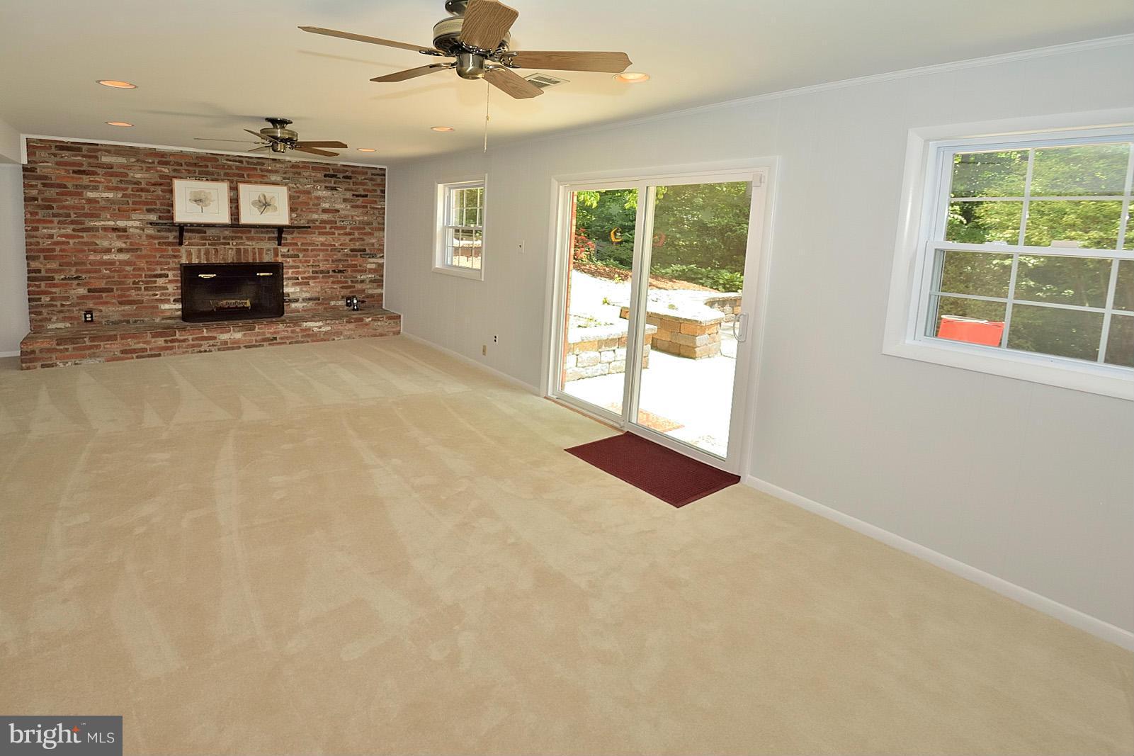 5613 Ravenel Lane Springfield, VA 22151 - Photo 23 of 30 an empty room with windows and fireplace