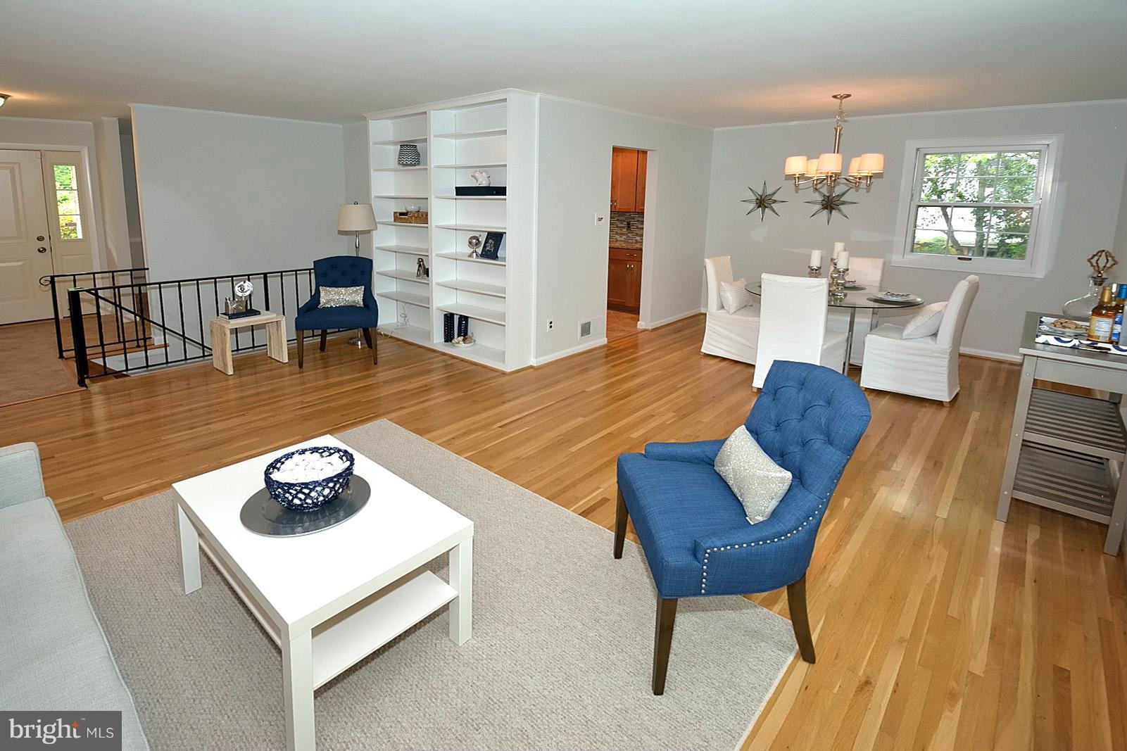 5613 Ravenel Lane Springfield, VA 22151 - Photo 6 of 30 a living room with furniture and wooden floor