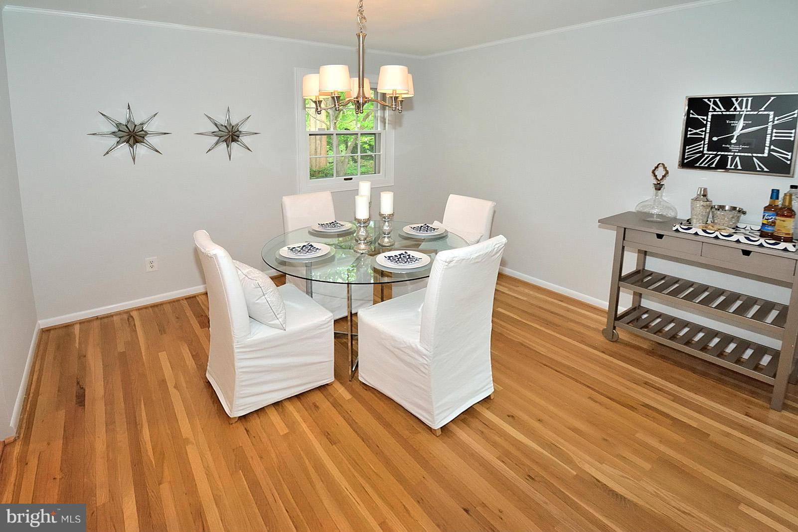 5613 Ravenel Lane Springfield, VA 22151 - Photo 8 of 30 a view of a dining room with furniture and wooden floor