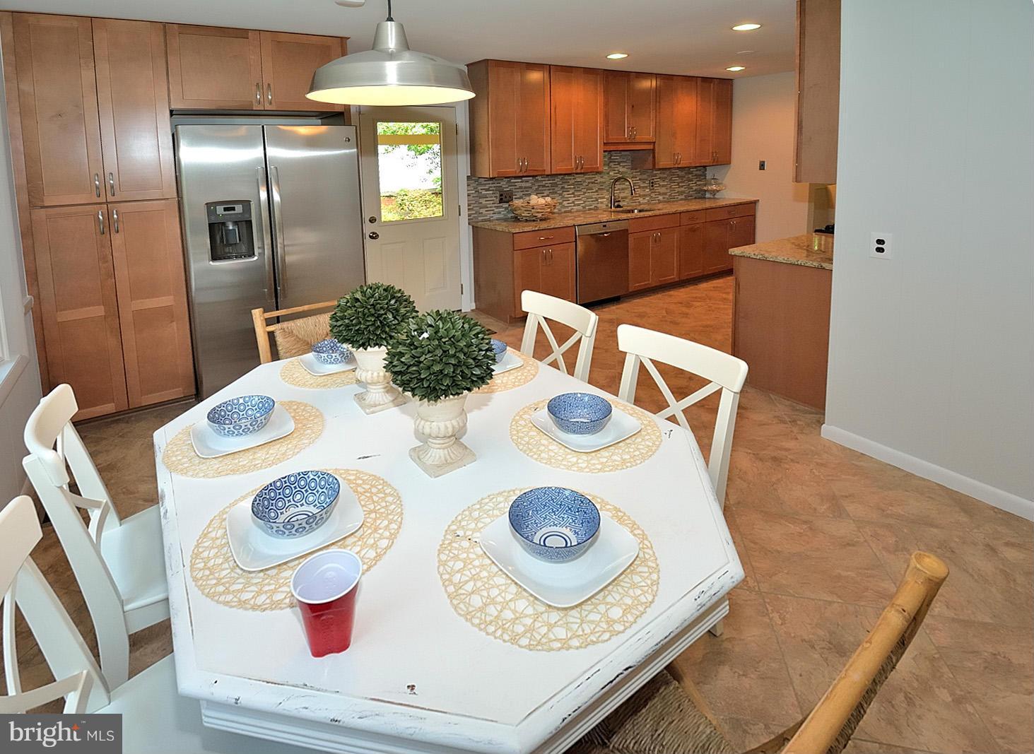 5613 Ravenel Lane Springfield, VA 22151 - Photo 10 of 30 a kitchen with a stove and refrigerator