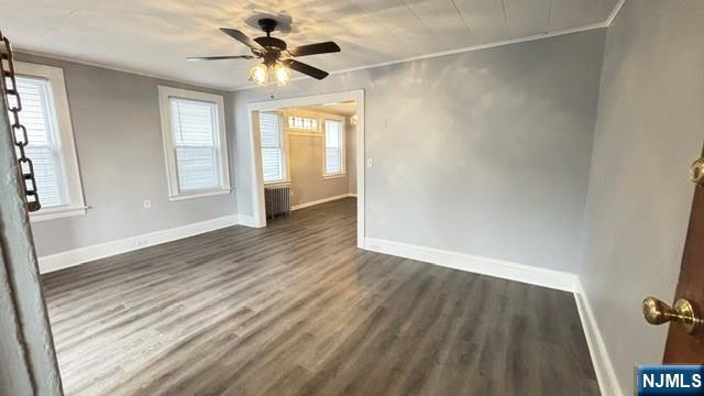 760 Hamilton Street, Unit 1 Harrison, NJ 07029 - Photo 2 of 23 wooden floor in an empty room with a window