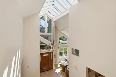 a spacious bedroom with a bed and a walk in closet