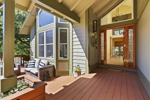 a kitchen with granite countertop stainless steel appliances a sink stove and microwave