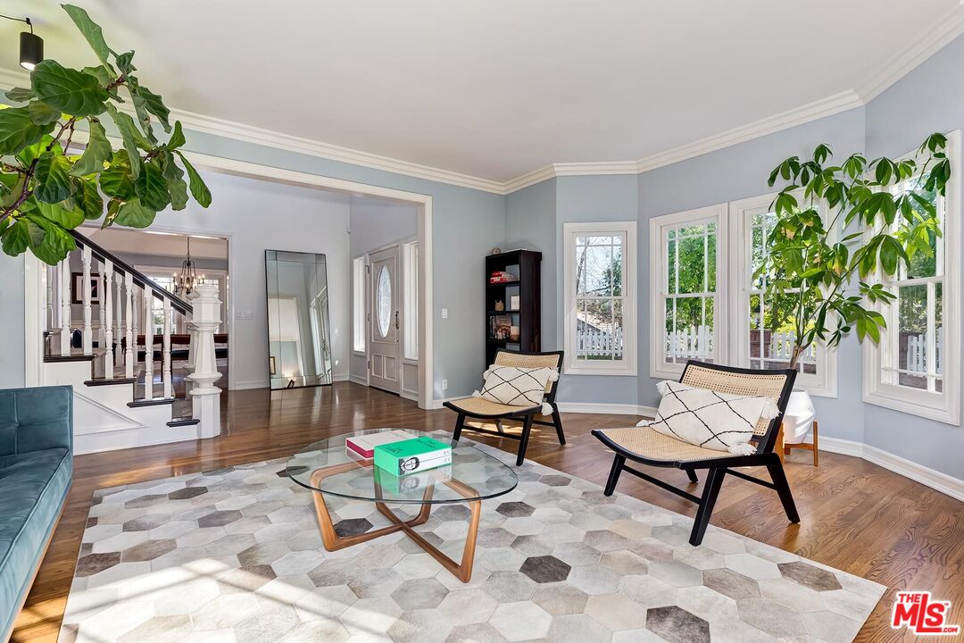 3827 Castle View Road Agoura Hills, CA 91301 - Photo 16 of 74 a living room with furniture a potted plant and a large window