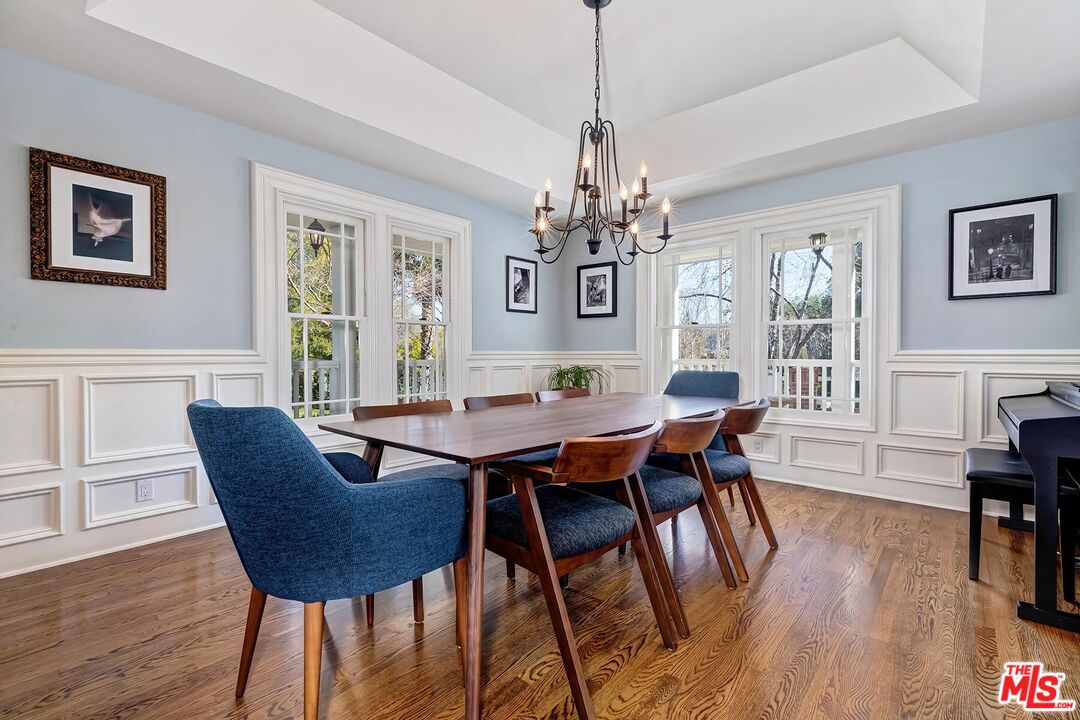 3827 Castle View Road Agoura Hills, CA 91301 - Photo 18 of 74 a view of a dining room with furniture wooden floor and chandelier