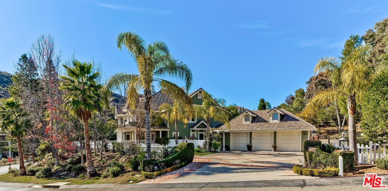 3827 Castle View Road Agoura Hills, CA 91301 - Photo 2 of 74 a front view of a house with a garden