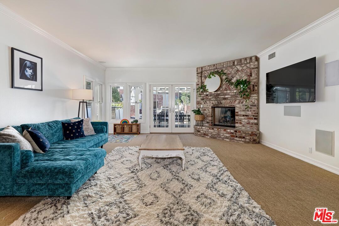 3827 Castle View Road Agoura Hills, CA 91301 - Photo 23 of 74 a living room with fireplace furniture and a flat screen tv
