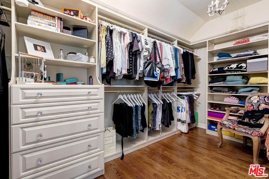 3827 Castle View Road Agoura Hills, CA 91301 - Photo 48 of 74 a view of walk in closet with clothes and shoes