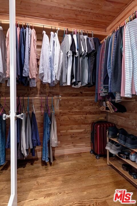 3827 Castle View Road Agoura Hills, CA 91301 - Photo 49 of 74 a view of walk in closet with clothes and shoes
