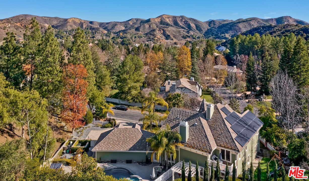 3827 Castle View Road Agoura Hills, CA 91301 - Photo 68 of 74 an aerial view of a house with a mountain