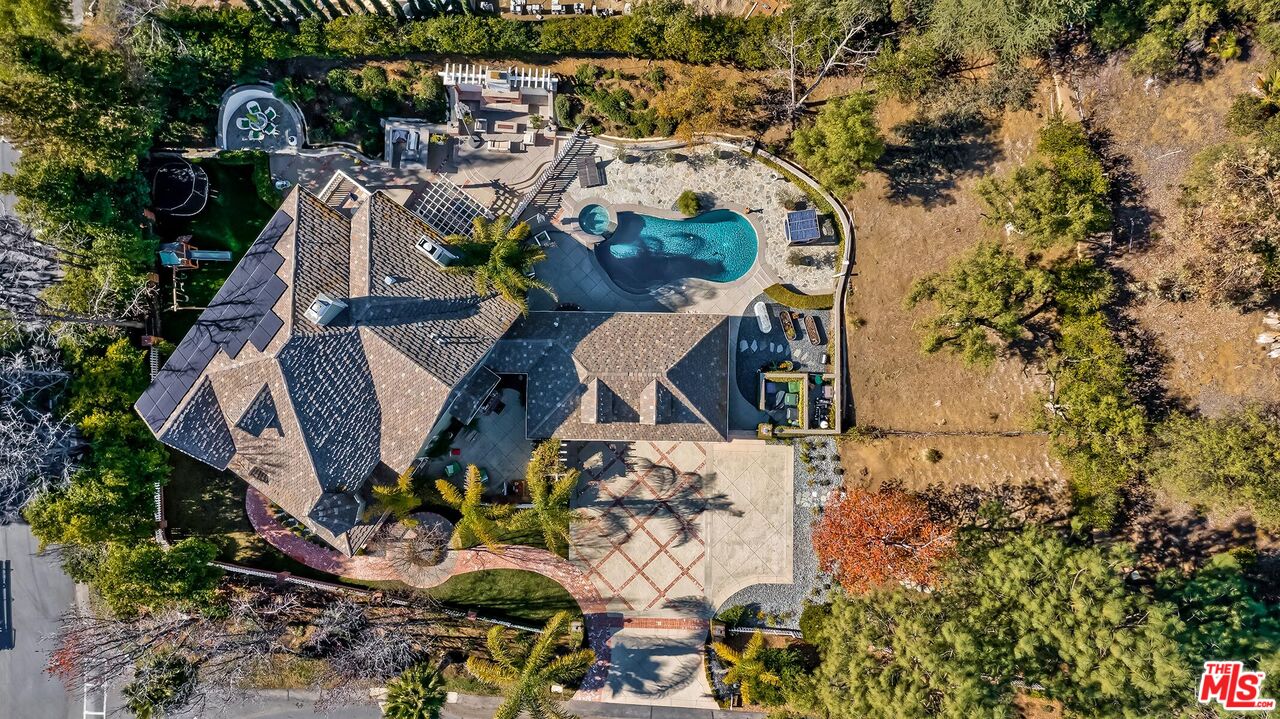 3827 Castle View Road Agoura Hills, CA 91301 - Photo 72 of 74 an aerial view of a house with garden space and street view